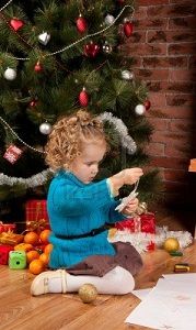 11506937-little-girl-near-christmas-tree.jpg